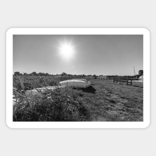 Rowing boats on the river bank in Thurne, Norfolk Sticker